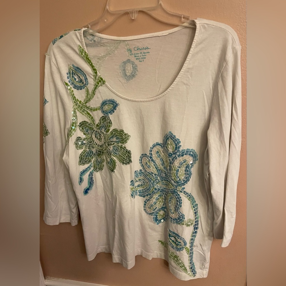 Chico’s Woman’s shirt size 2 ( L = 12-14) normal sizes )